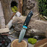 Classic drop point hunter - double black linen Micarta - turquoise spacer - aluminum pins